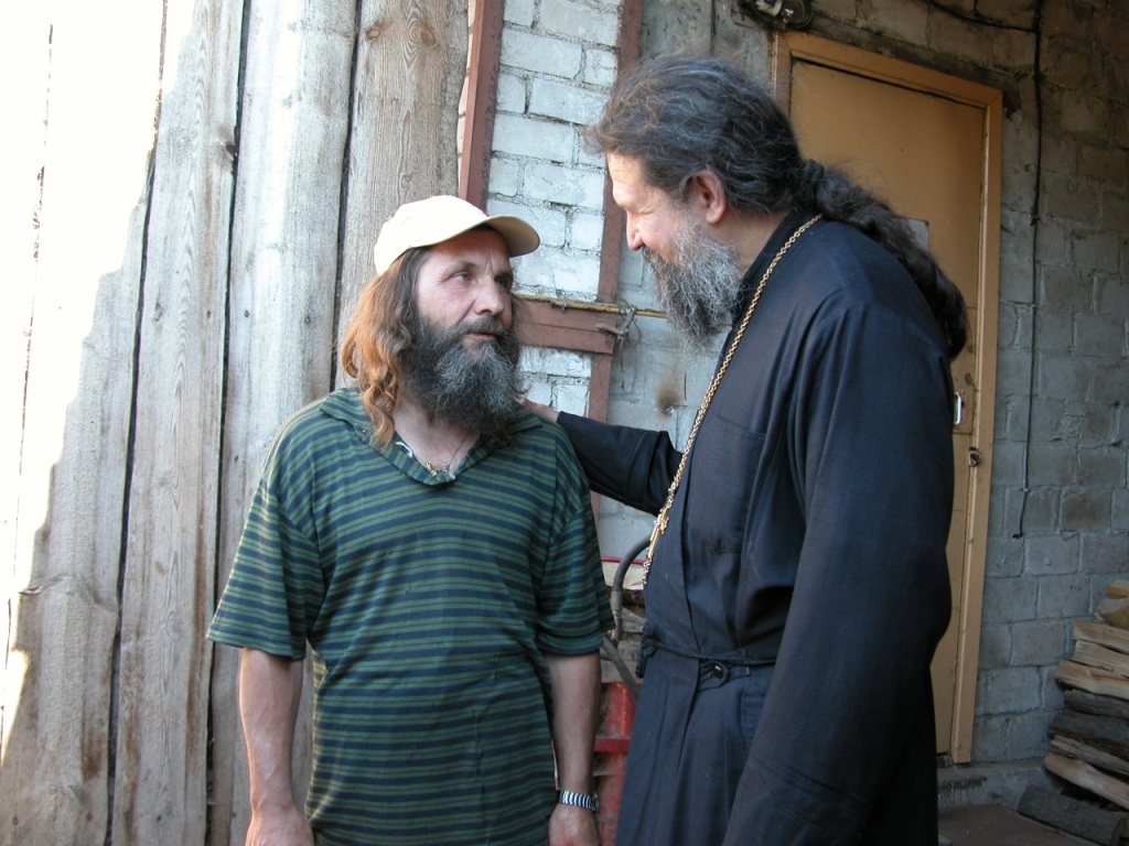 a man and Father Andrey Lemeshonok