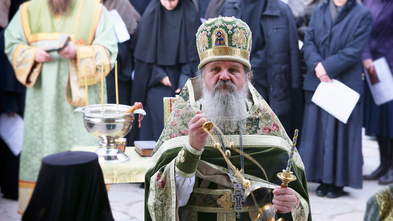 orthodox priest in green vestment