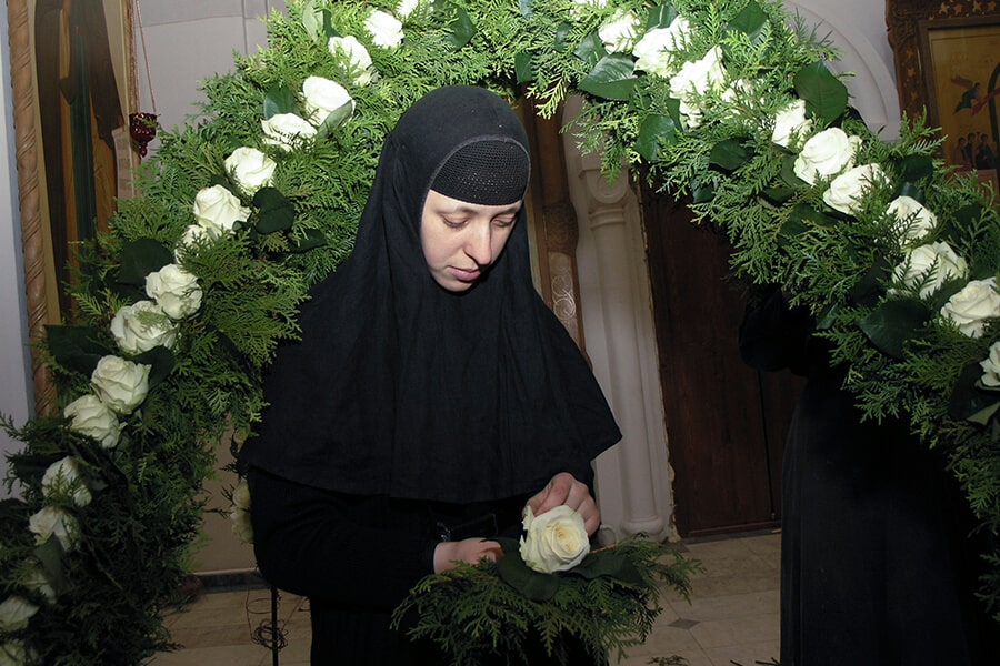 Putting flowers in the church