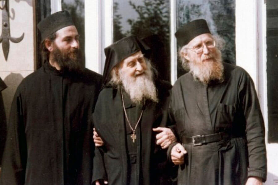Elder Sophrony supported by two of the fathers